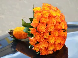 Оранжевый букет невесты из роз